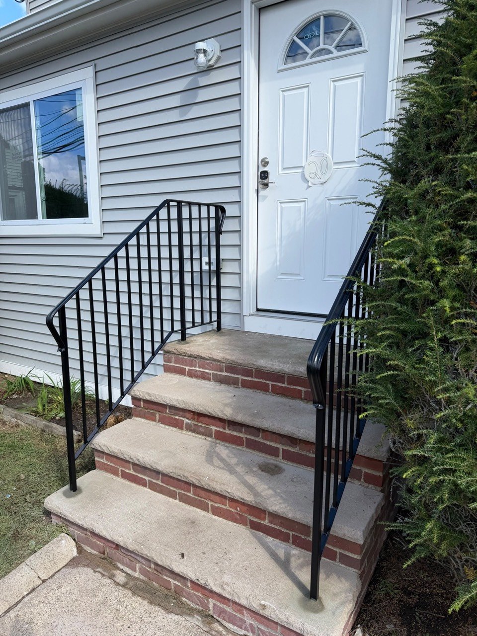 Brick steps with steel railings