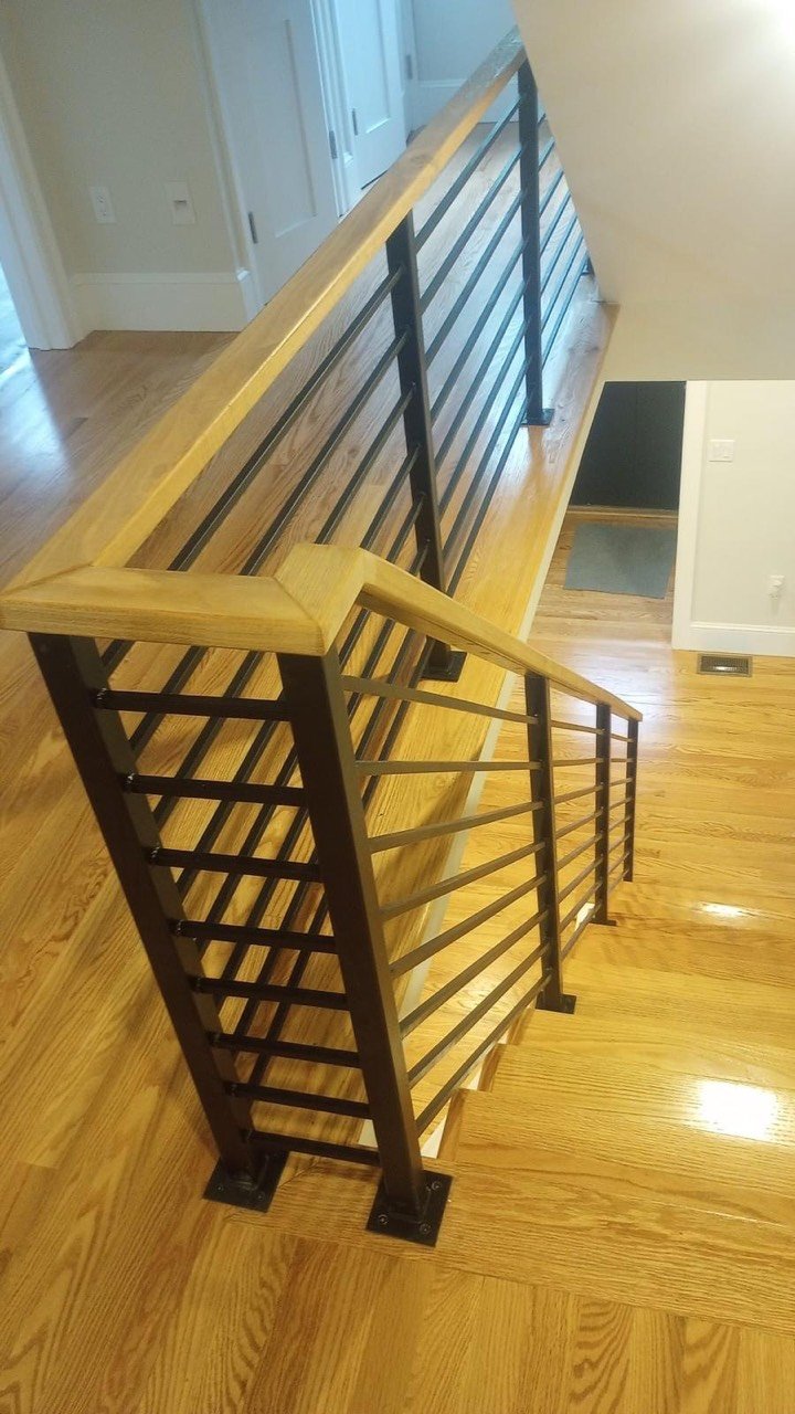 Stair railing with wood handrail